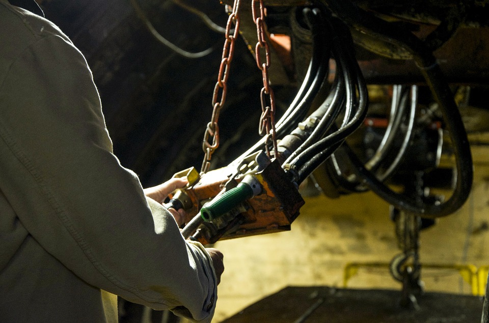 man holding wires